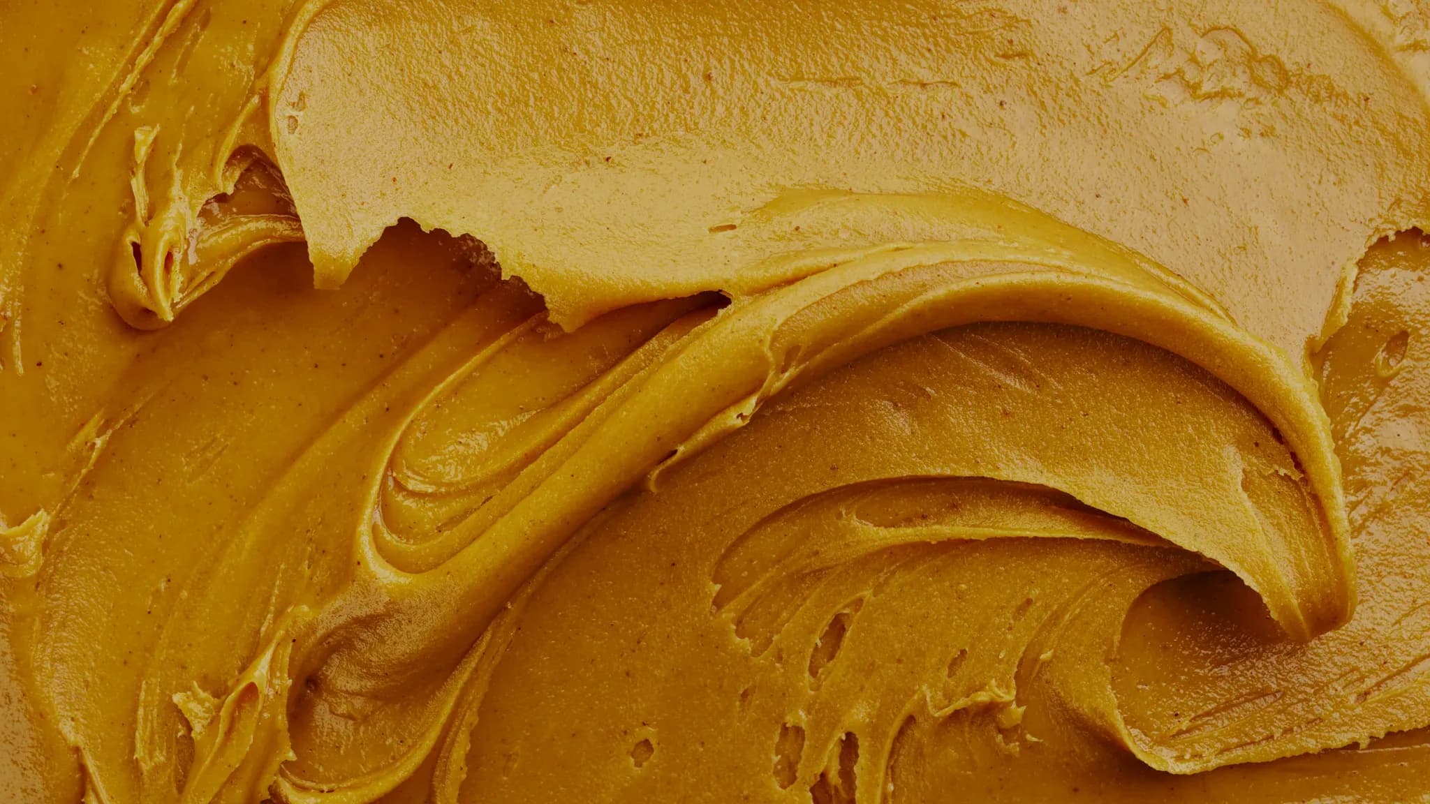 A close-up swirl of peanut butter.